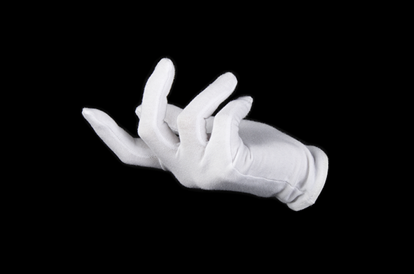 Stink: A white gloved right hand viewed side on against a black background beckons to an unseen presence