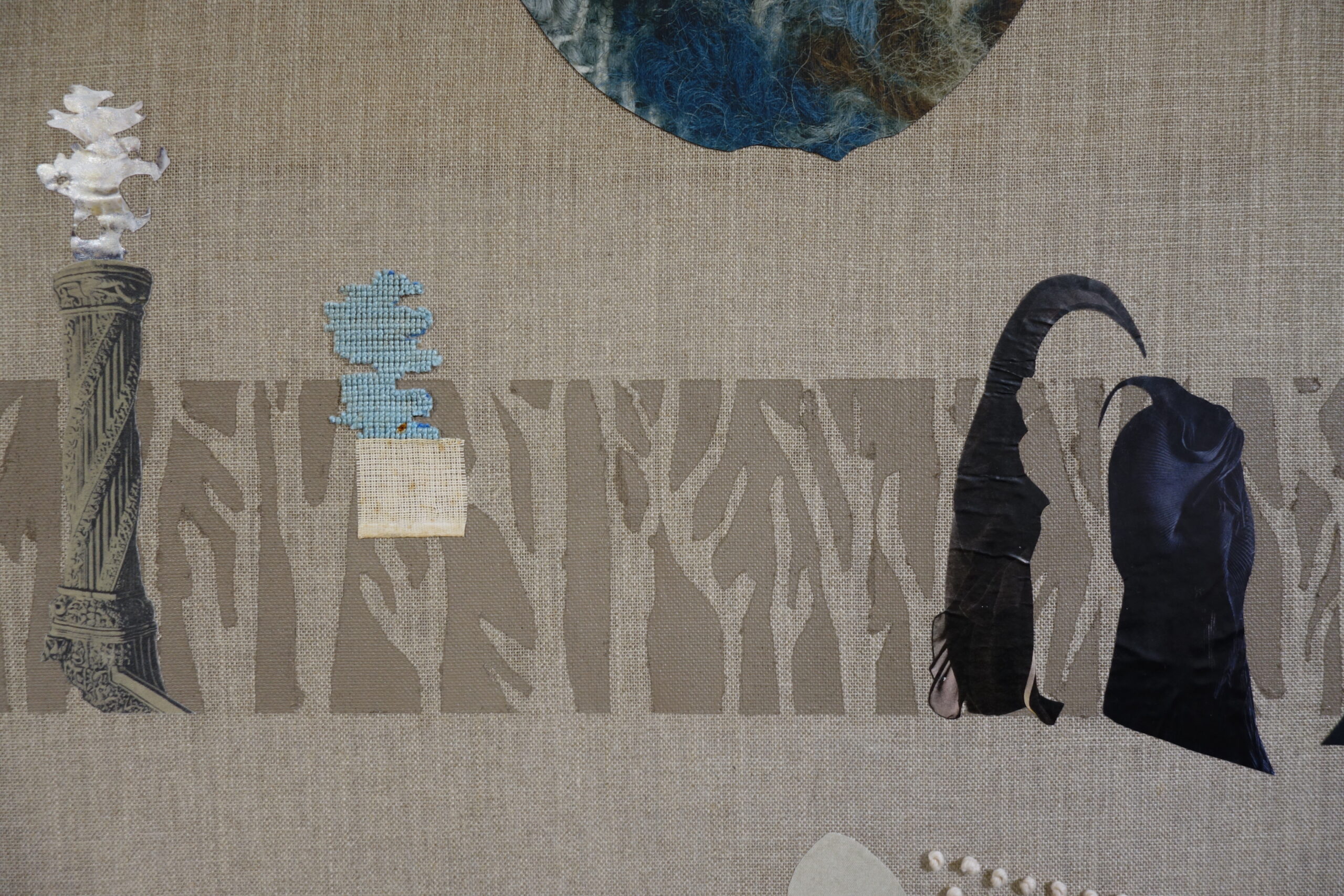 When much had been forgotten: fragments of tapestry, collage and embroidery in the shape of statues and organic forms are scattered across a pale grey-brown linen
